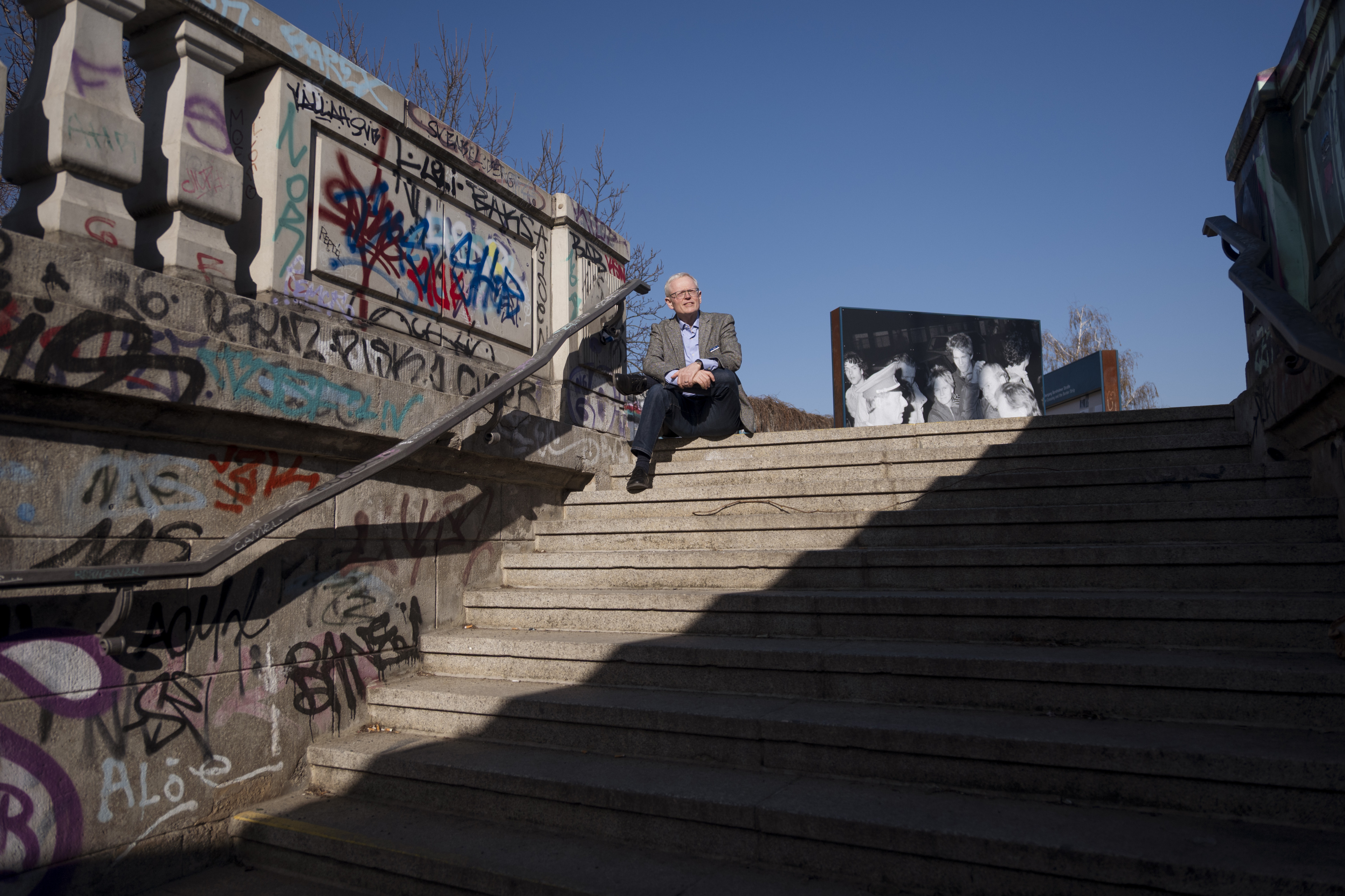Ian Johnson sits on stairs 